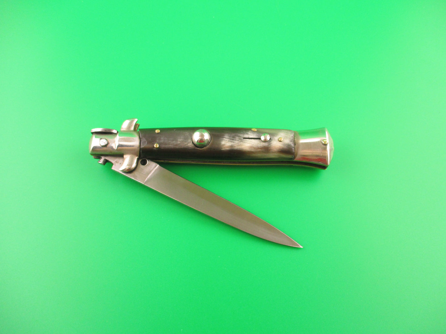 Foldable knife on a green background