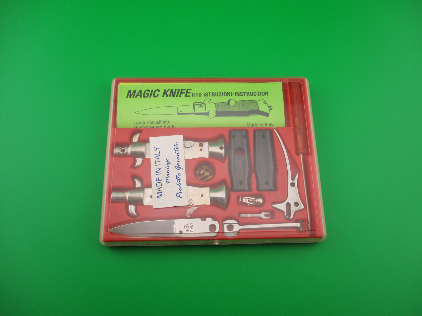 Magic Knife Kit Red background black scales vintage stiletto made Italy