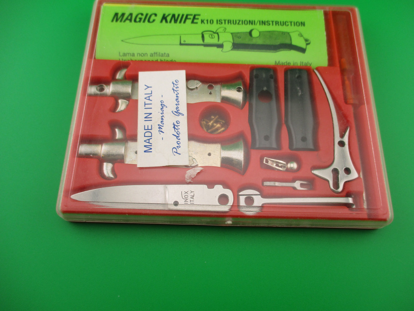 Magic Knife Kit Red background black scales vintage stiletto made Italy