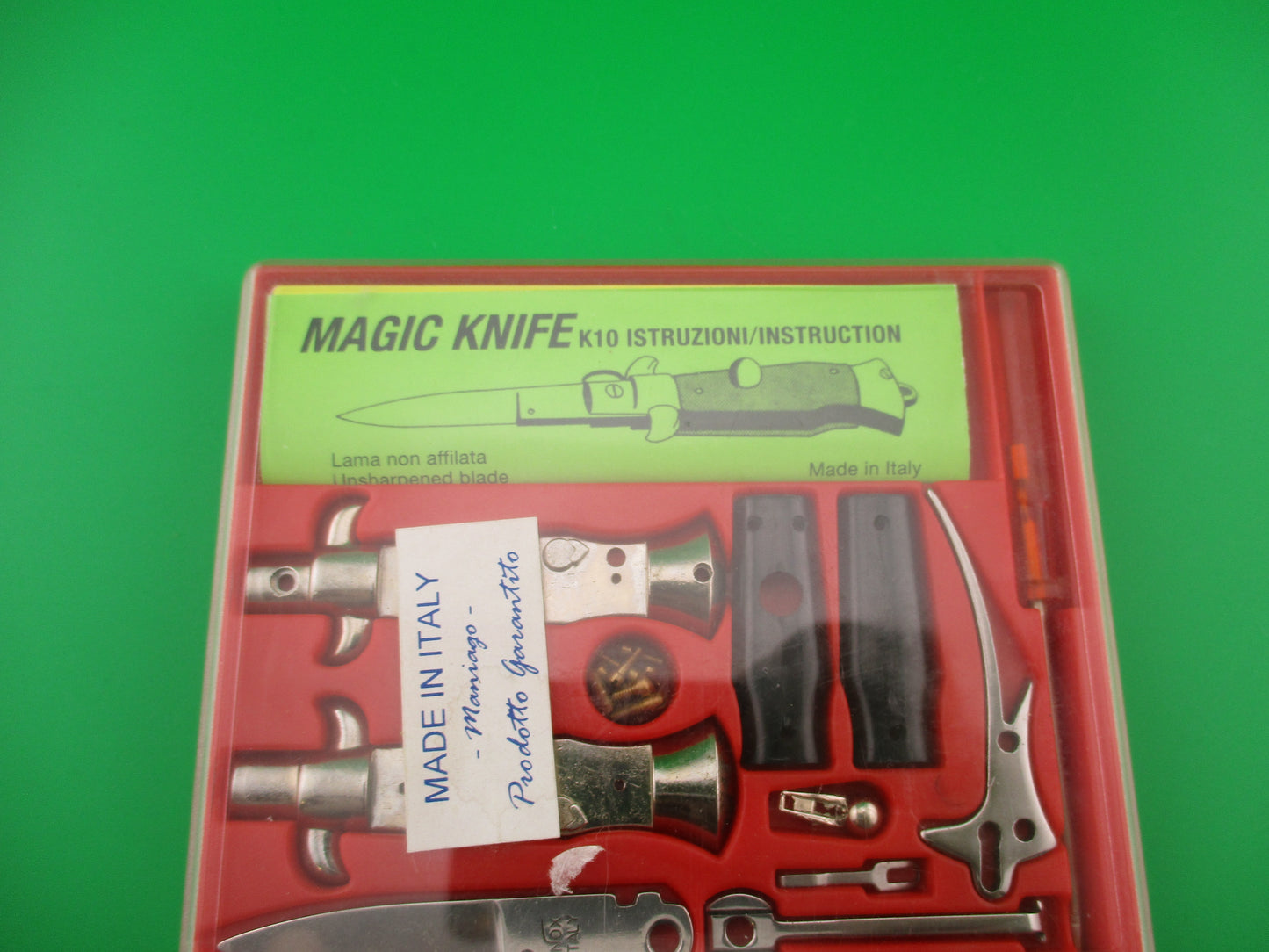 Magic Knife Kit Red background black scales vintage stiletto made Italy