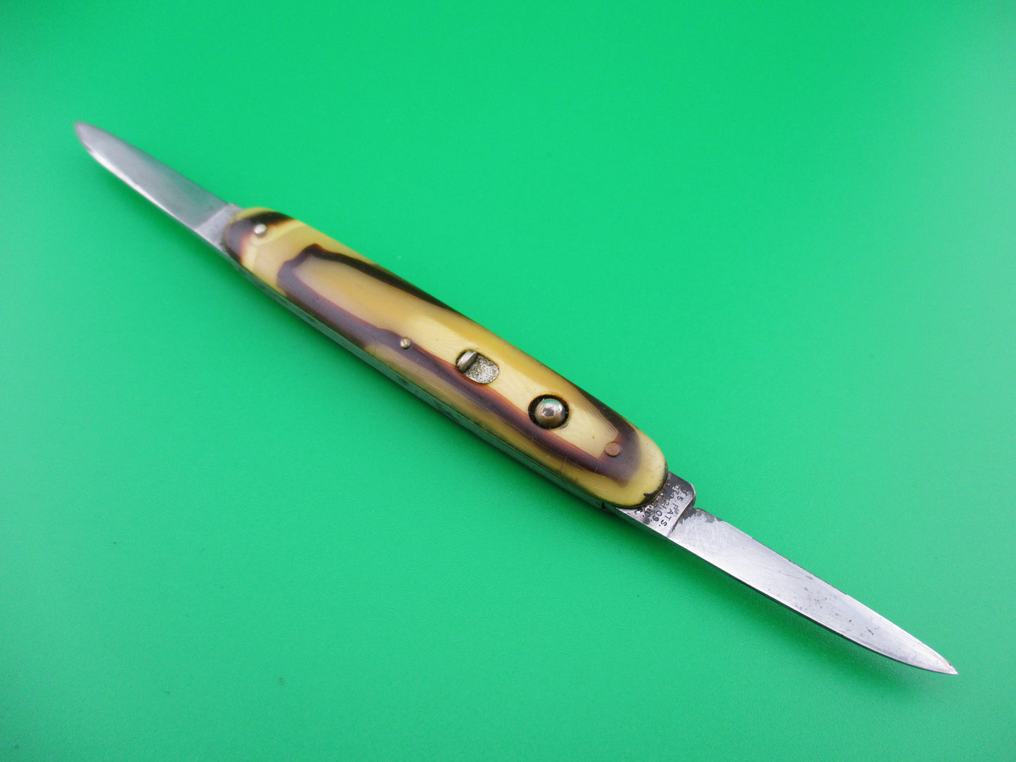 z Schrade Cut Co small double Butter & Molasses cell switchblade knife