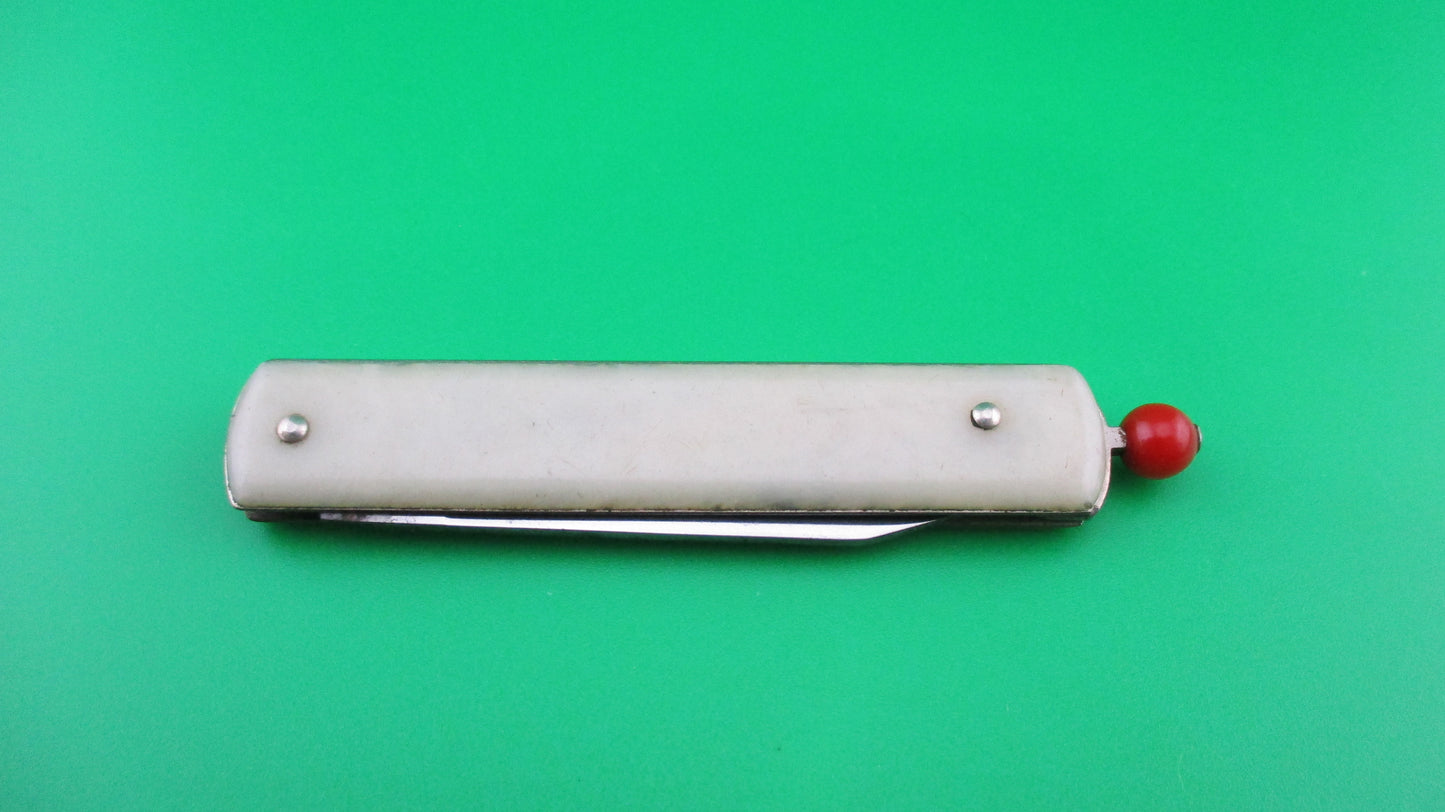 Remington R17 Pullball Onyx scales Red pull automatic knife