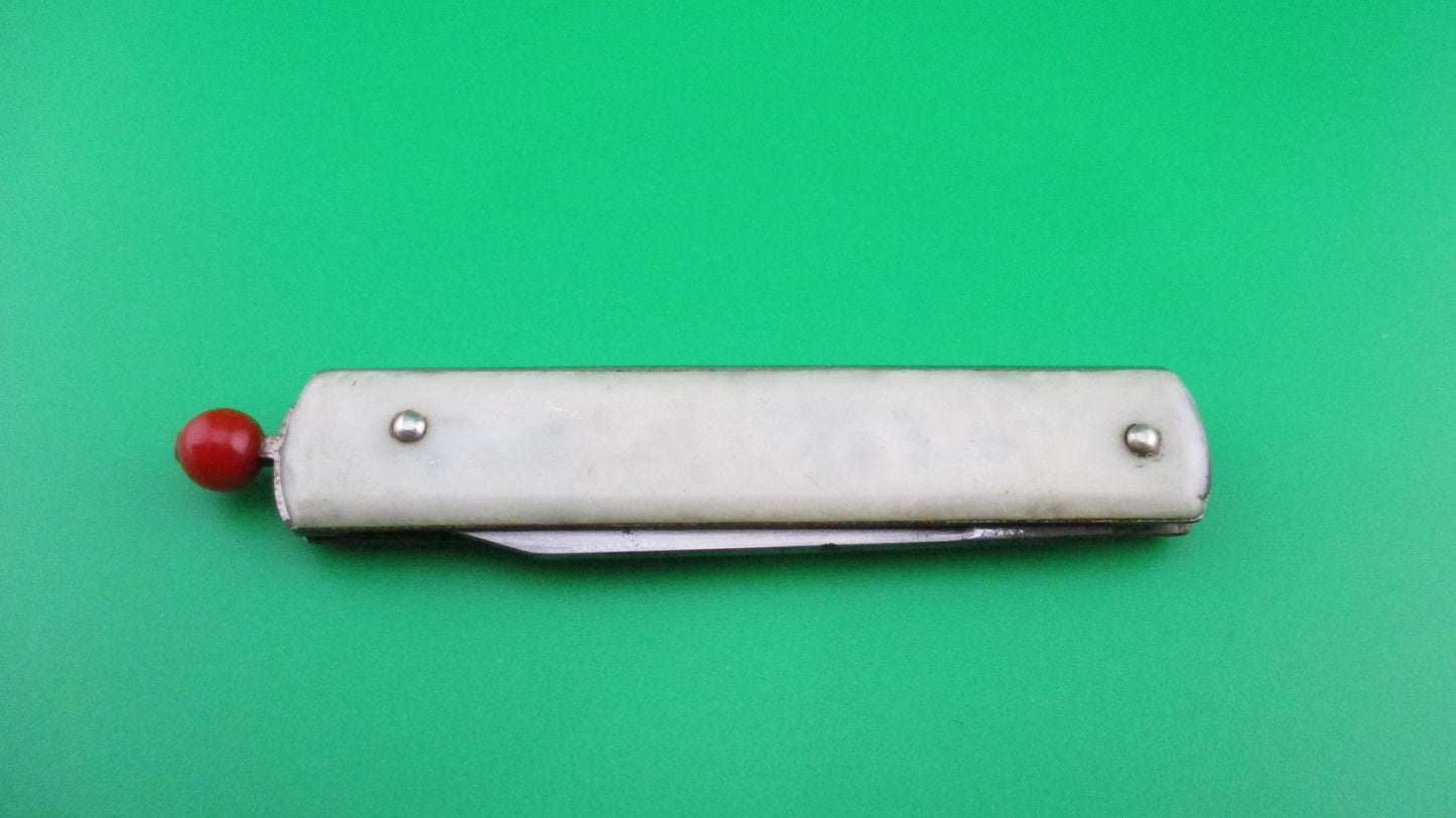 Remington R17 Pullball Onyx scales Red pull automatic knife