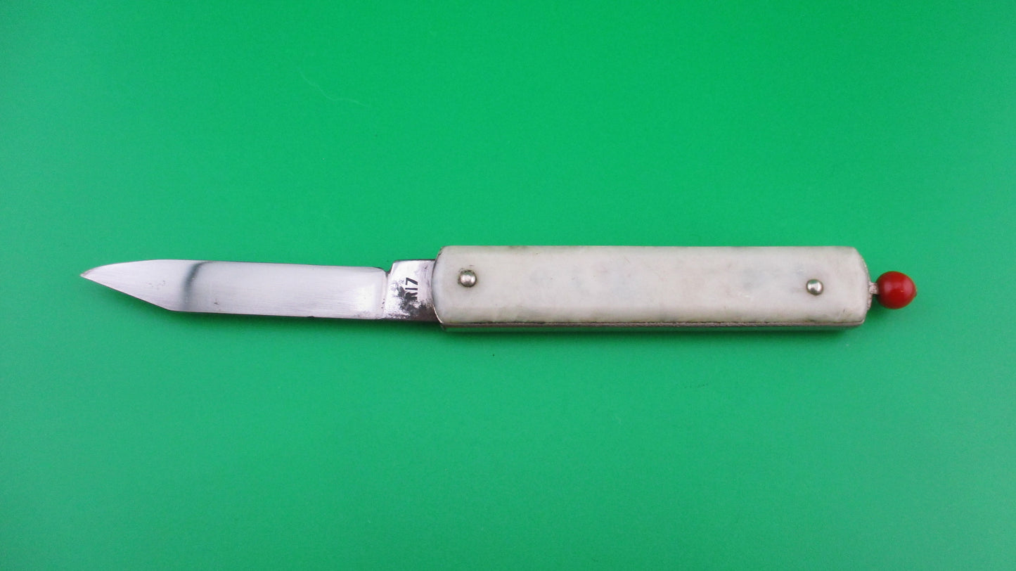 Remington R17 Pullball Onyx scales Red pull automatic knife