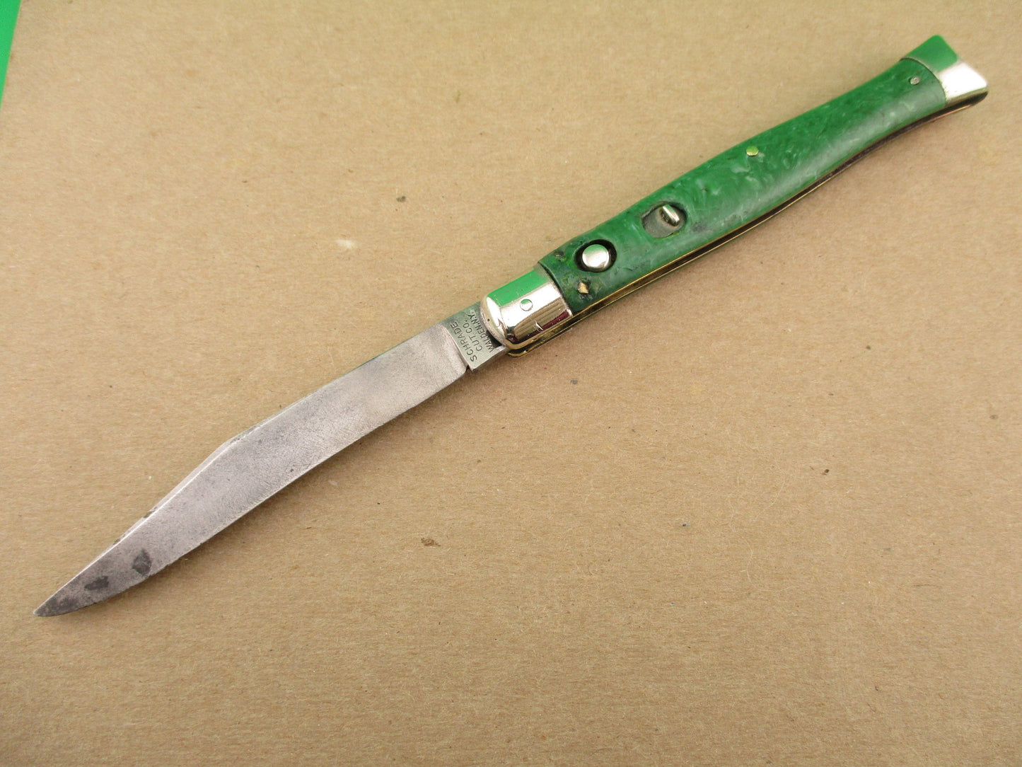 Schrade Cut Co Fishtail Green swirl vintage automatic knife with bolsters