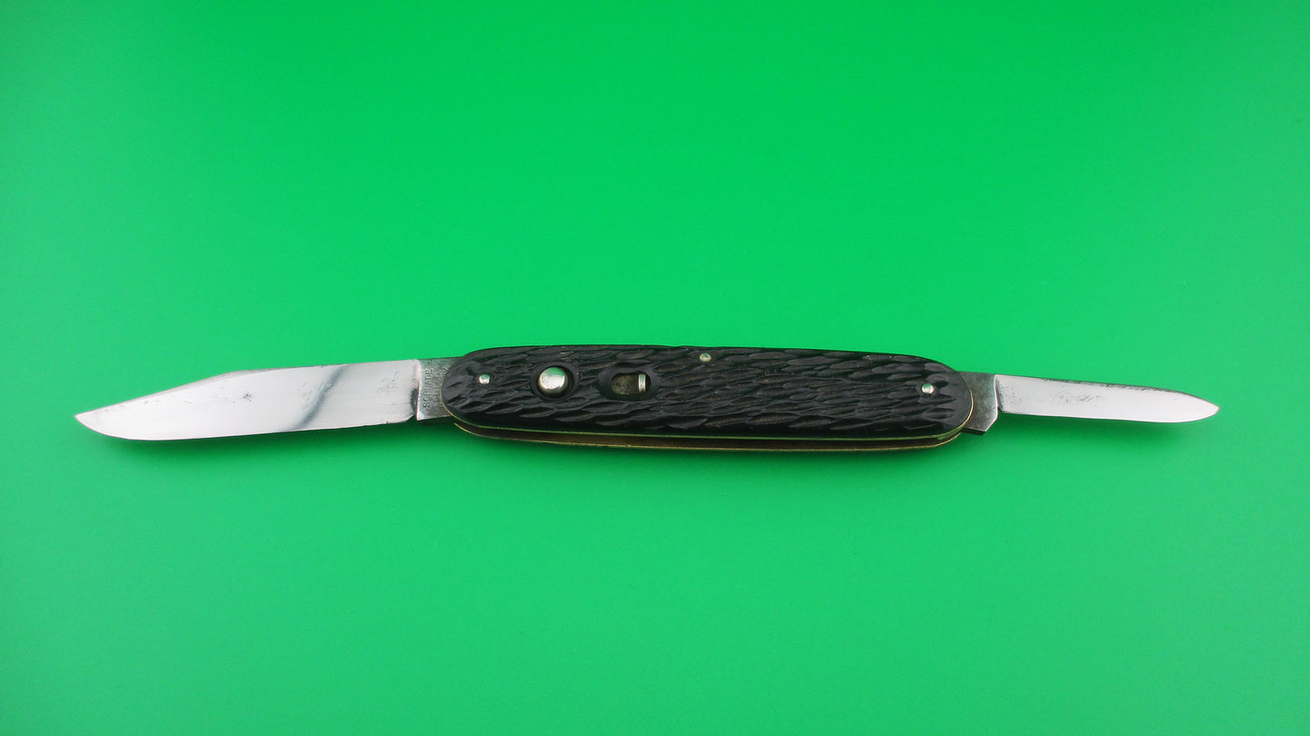 Schrade Cut Co Large Double 3 3/4 inch Black jigged switchblade knife