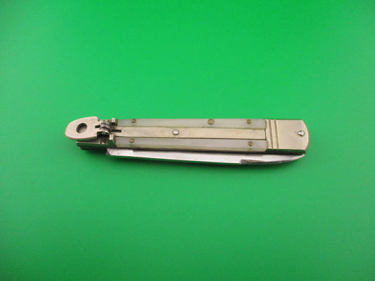 Folding knife on a green background