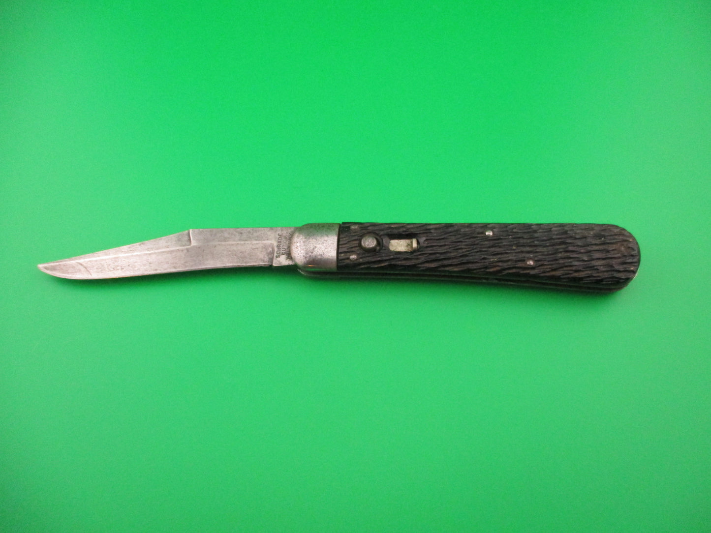 Schrade Cut Co 1614 3/4 Hunter Saber grind Black stagged automatic knife