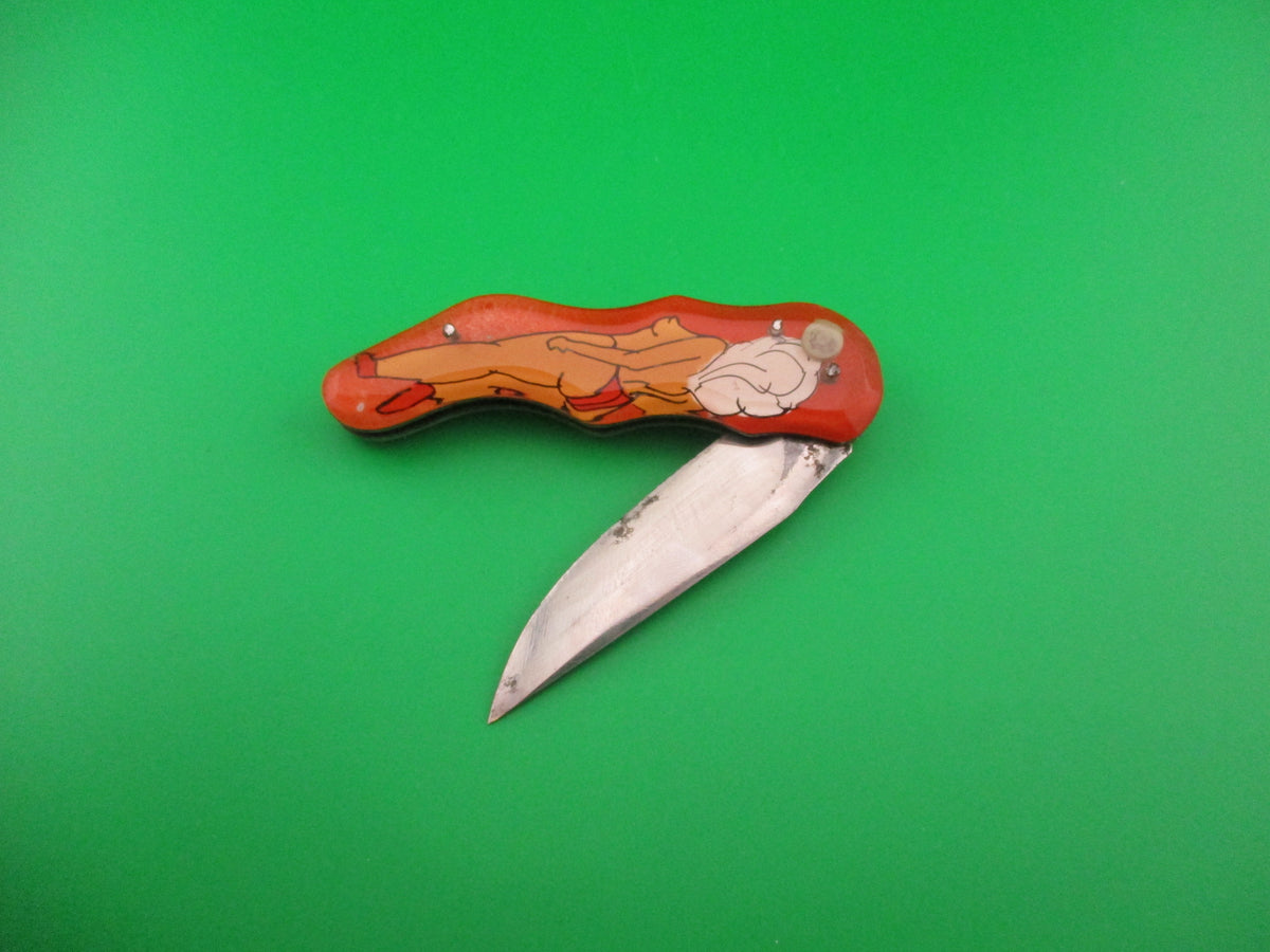 Russian Prison Knife Sexy Pinup Woman white hair topless pinup switchblade knife
