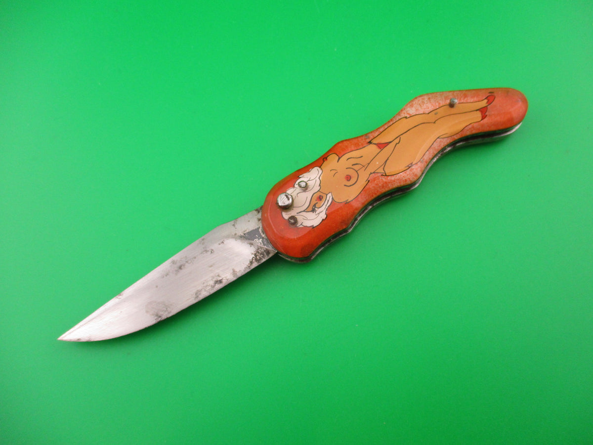 Russian Prison Knife Sexy Pinup Woman white hair topless pinup switchblade knife