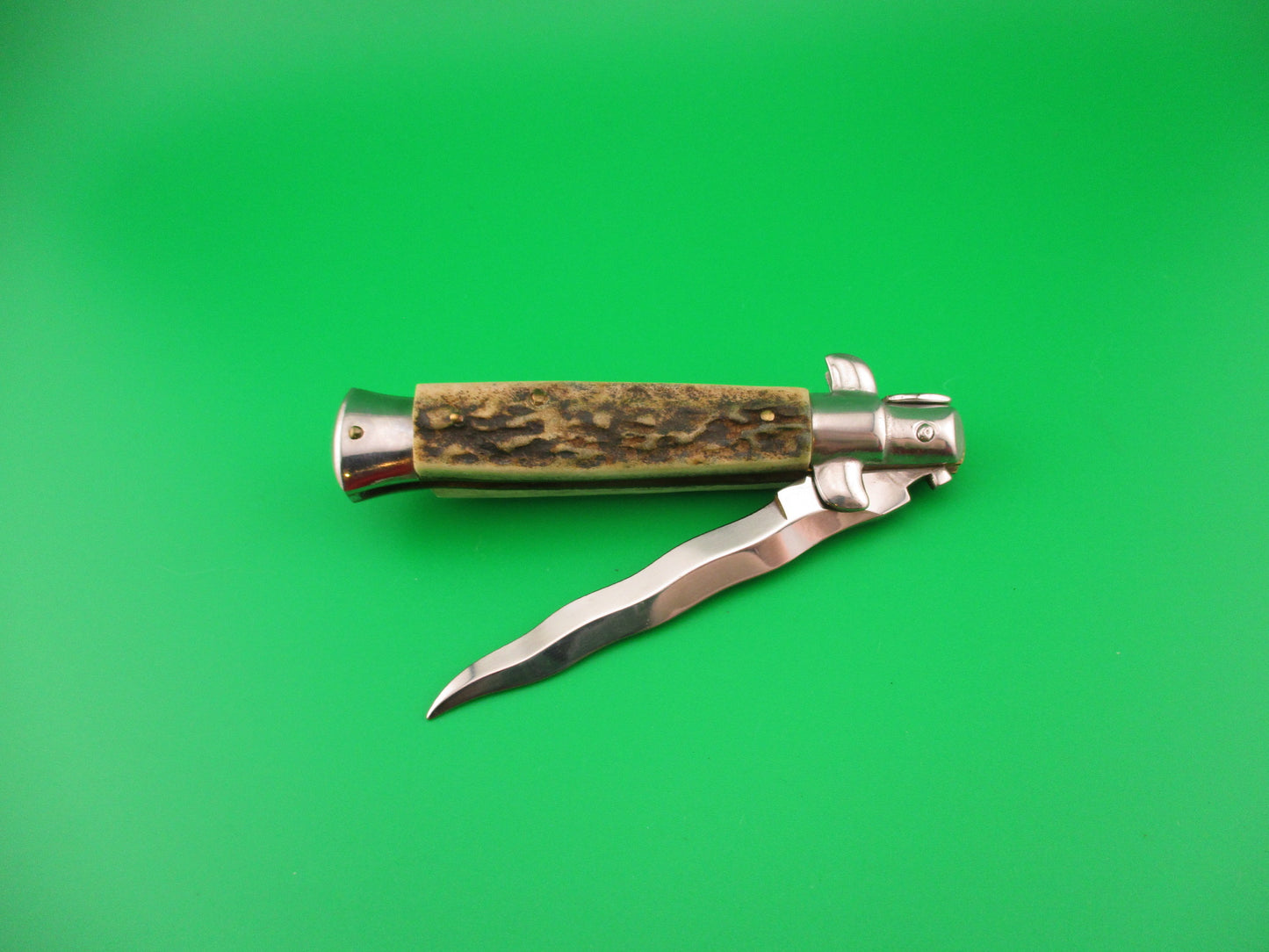 AKC MADE IN ITALY 18cm Italian Stag swivel bolster KRIS blade automatic knife