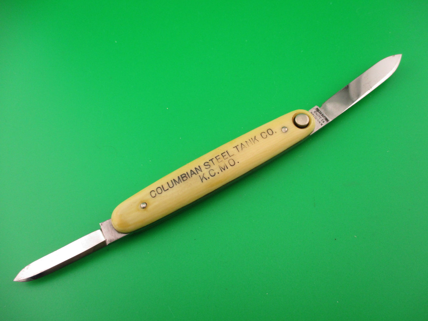 Press Button Knife Co Medium double Ivory cell Columbian Steel Tanks switchblade
