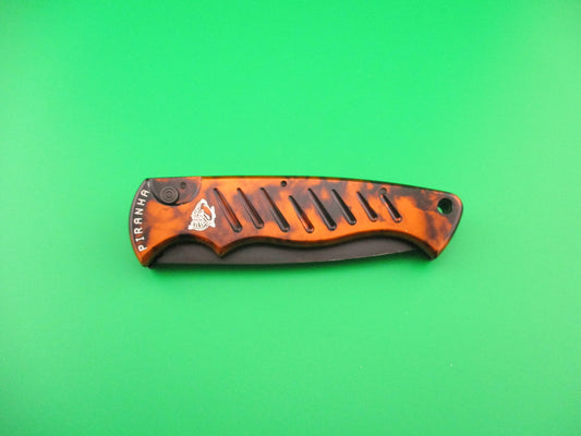 PIRANHA Pocket Copper (red) Marble black partially serrated blade automatic knife
