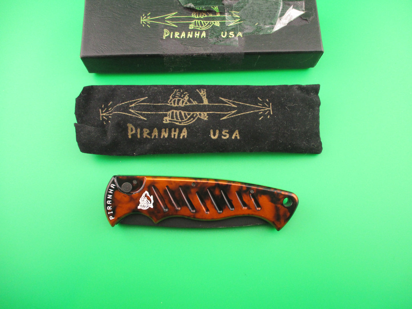 PIRANHA Pocket Copper (red) Marble black partially serrated blade automatic knife