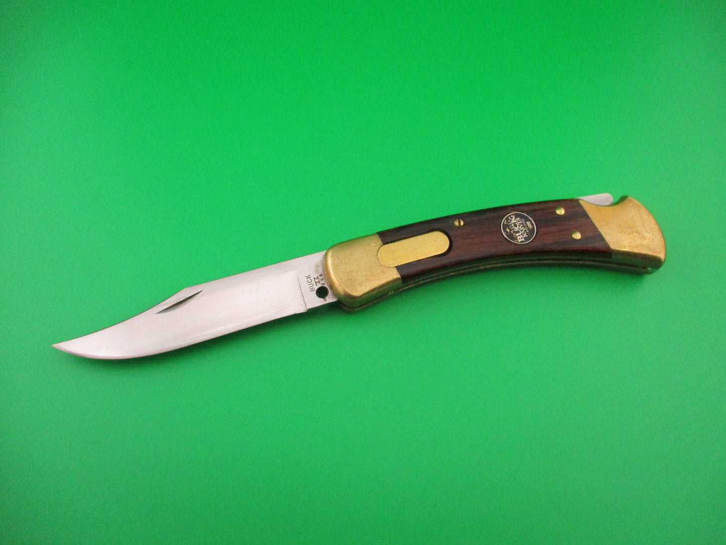 BUCK USA 110 Converted SA Wood Brass 100th Anniversary lockback automatic knife