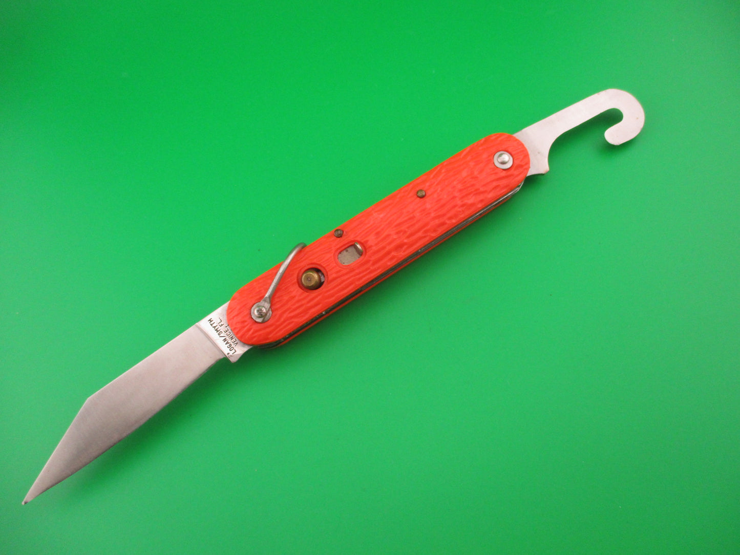 Logan Smyth Venice FL Orange Paratrooper automatic knife