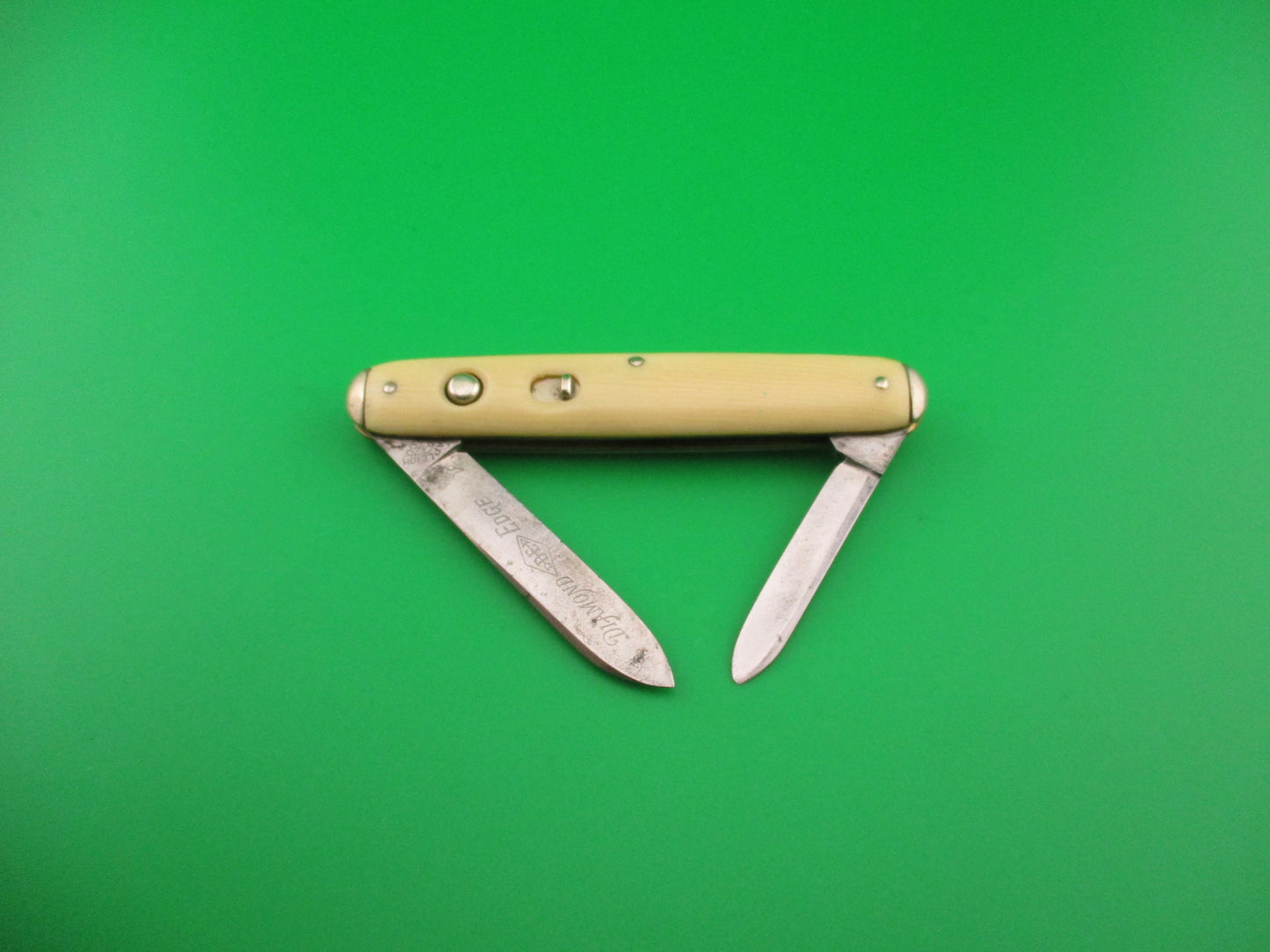 SHAPLEIGH HDW CO DE Etched Medium double Ivory cell Tip bolster switchblade knife