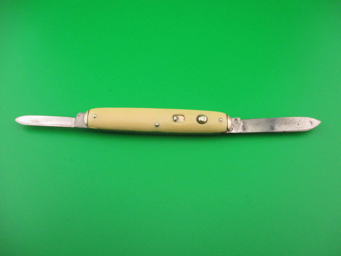 SHAPLEIGH HDW CO DE Etched Medium double Ivory cell Tip bolster switchblade knife