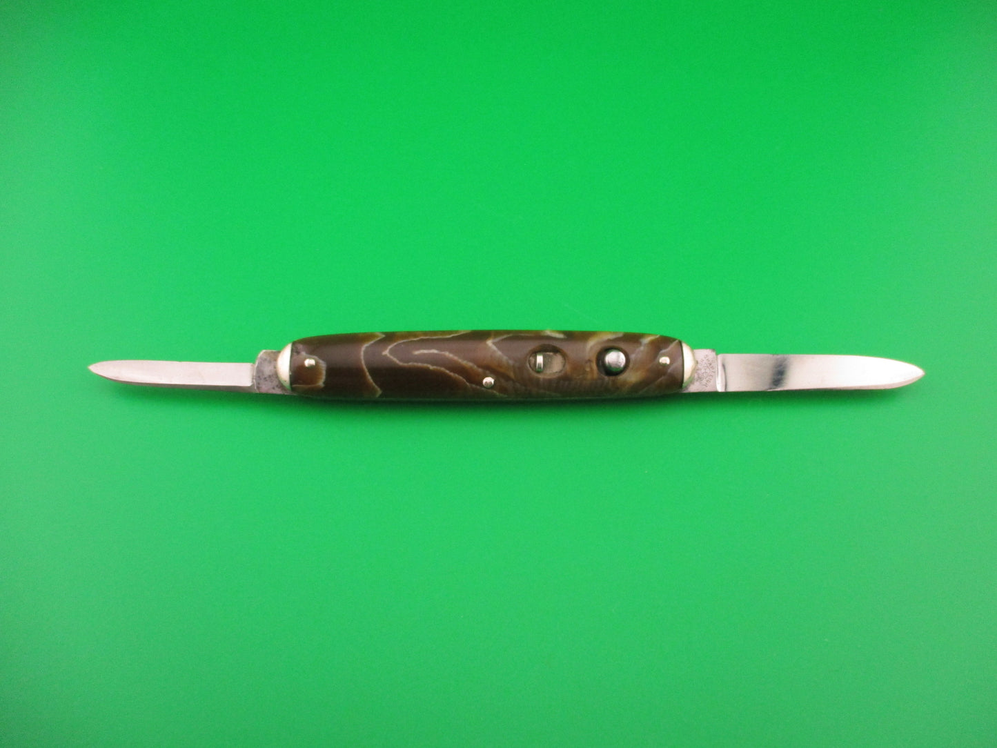 SHAPLEIGH HDW CO Medium double Caramel swirl Tip bolster vintage automatic knife