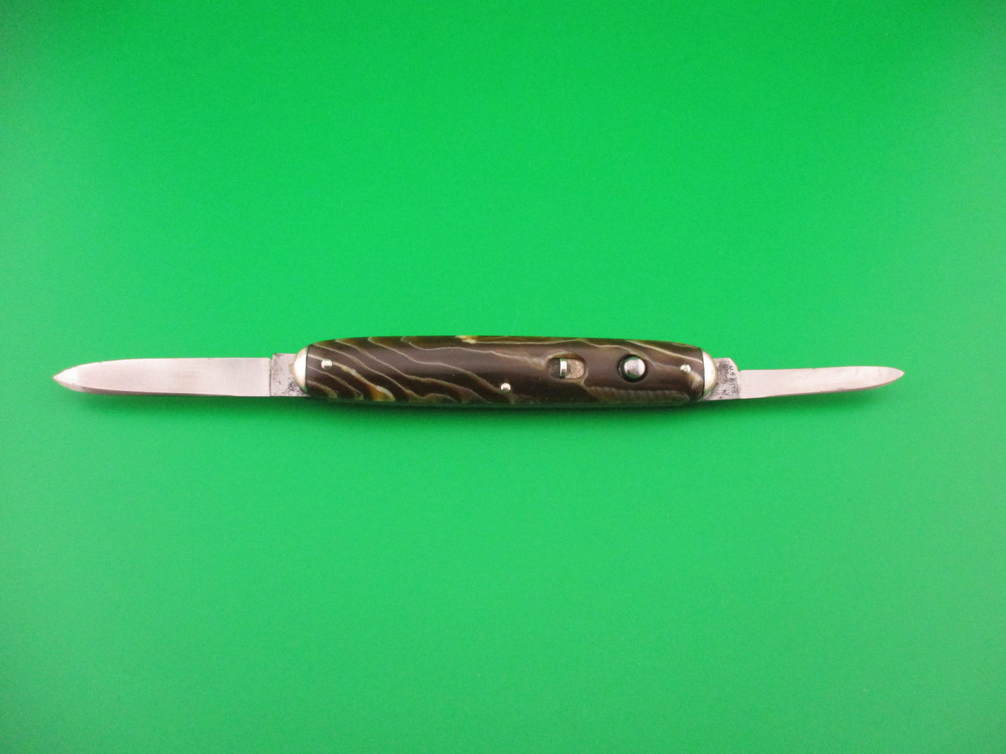 SHAPLEIGH HDW CO Medium double Caramel swirl Tip bolster vintage automatic knife