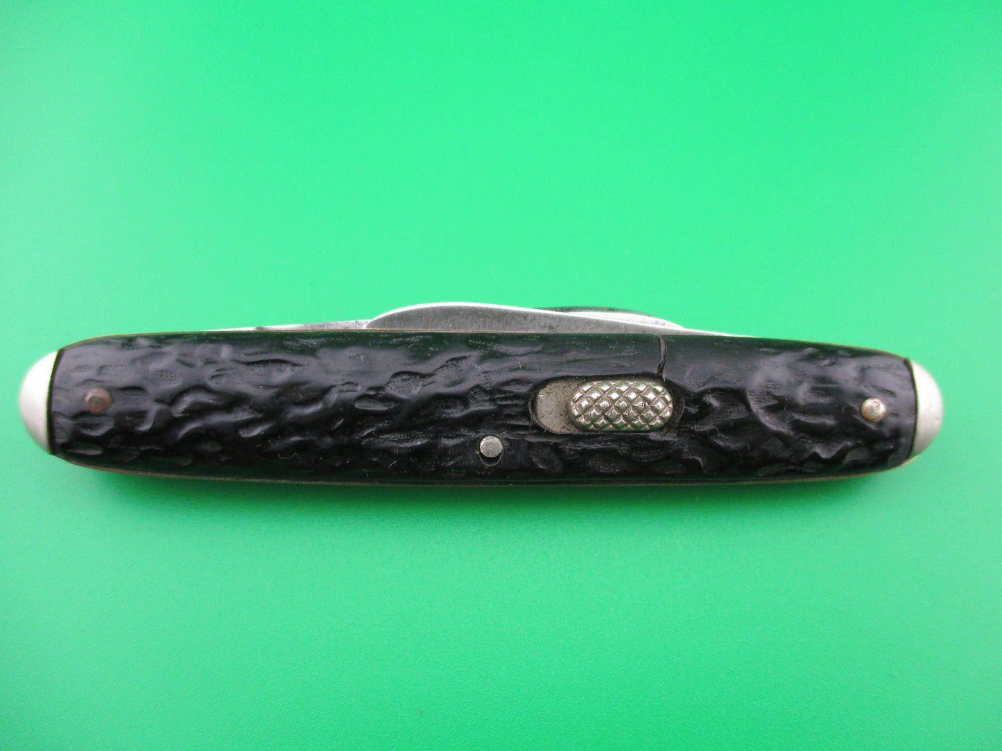 Vintage Flylock double Black jigged scales tip bolsters