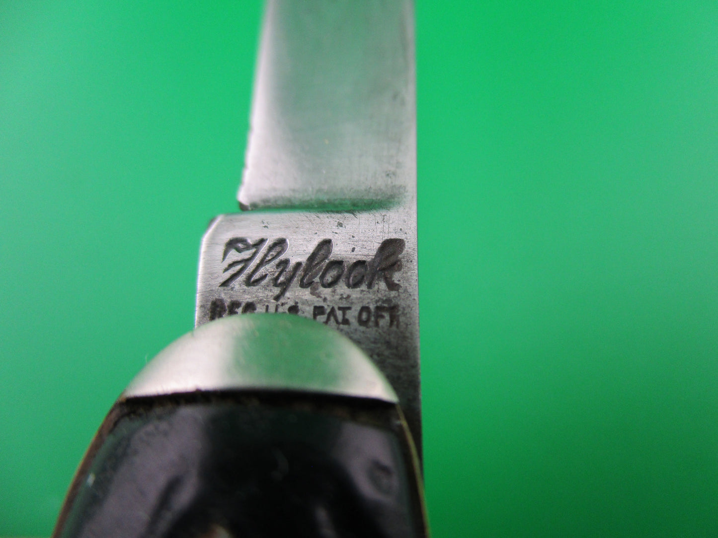Vintage Flylock double Black jigged scales tip bolsters