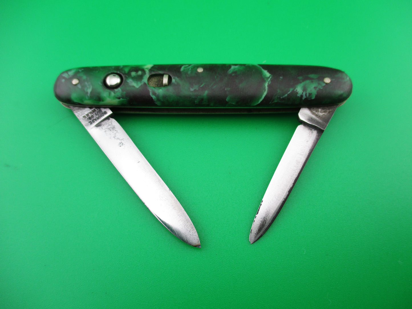 Schrade Walden small double 7444X Green black mottled celluloid switchblade knife