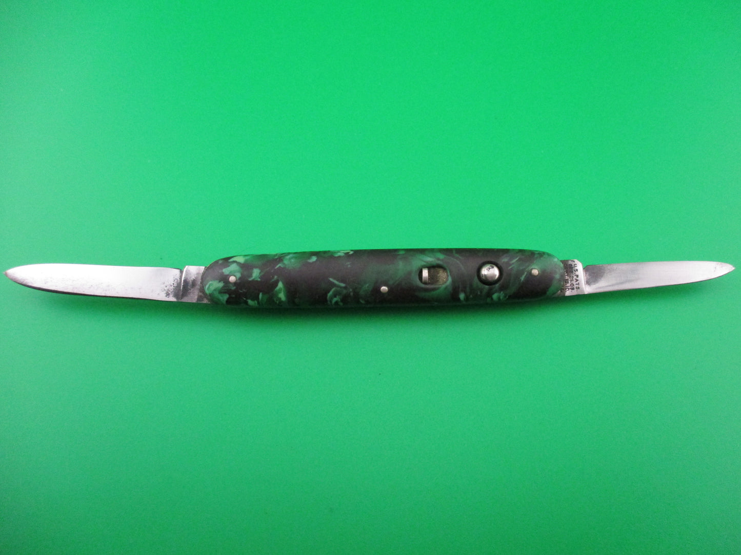 Schrade Walden small double 7444X Green black mottled celluloid switchblade knife