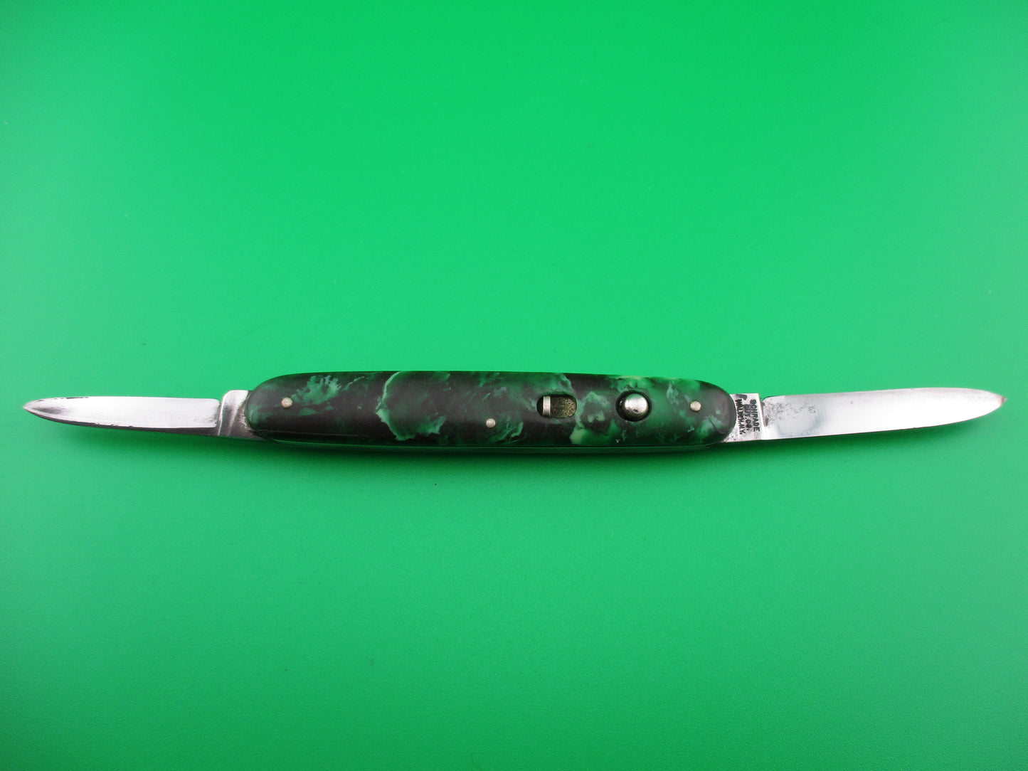 Schrade Walden small double 7444X Green black mottled celluloid switchblade knife