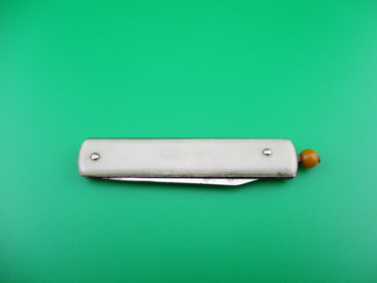 Remington R17 Pullball Onyx scales Orange pull automatic knife