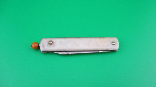 Remington R17 Pullball Onyx scales Orange pull automatic knife